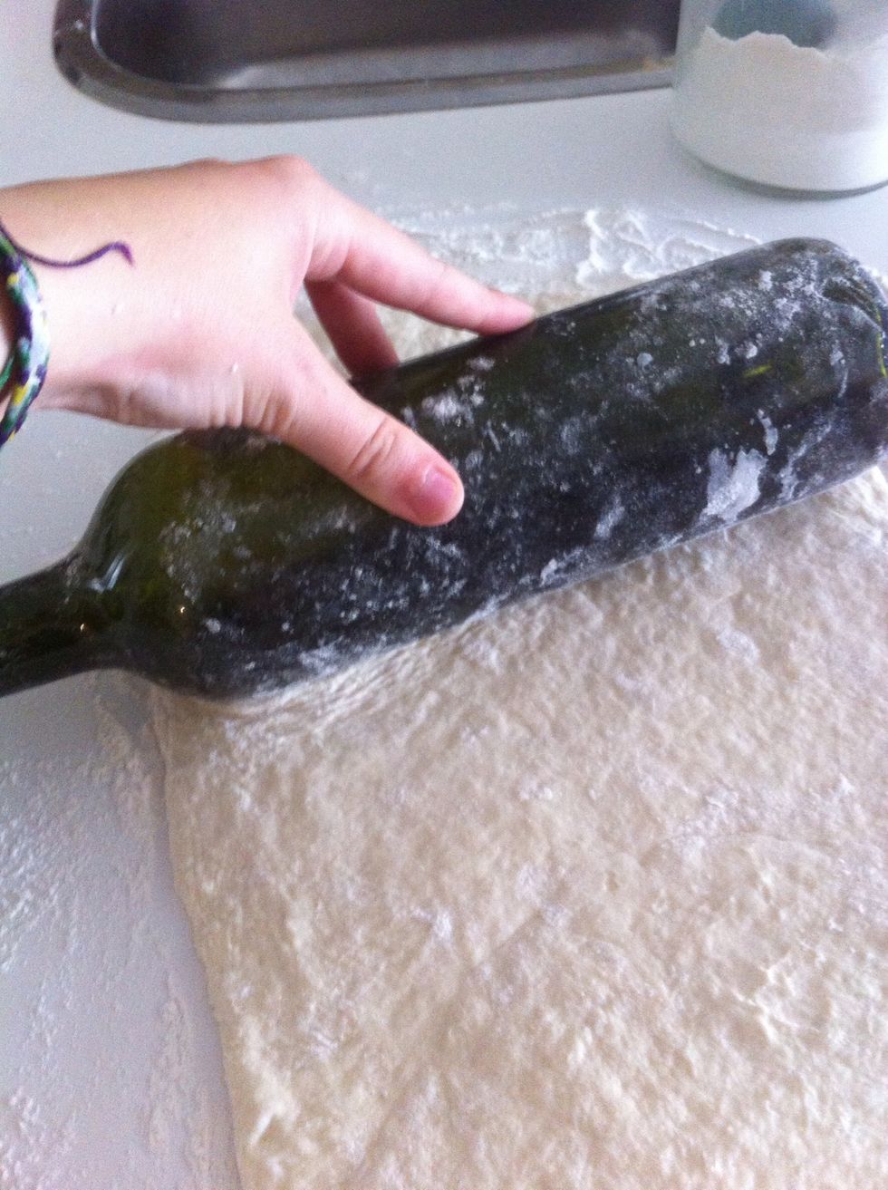 Roll the dough into a rectangle! Don't be afraid to add more flour if you need to. I used a wine bottle because I couldn't find a rolling pin! :) \ud83c\udf77\ud83c\udf77