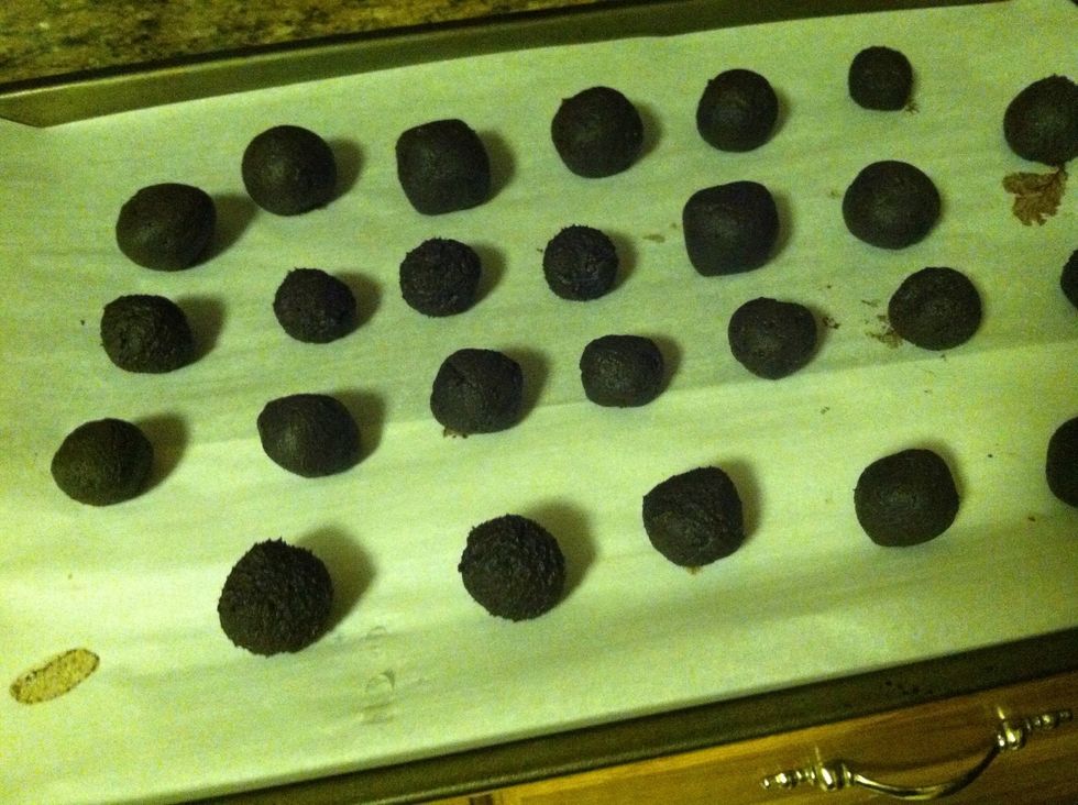 Roll the dough into balls and place on a baking sheet lined with parchment paper. Place balls in the freezer for at least 15 minutes.