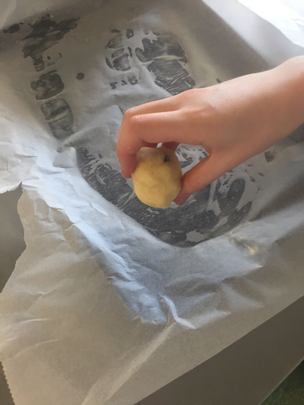 Roll the dough into balls and place on tray
