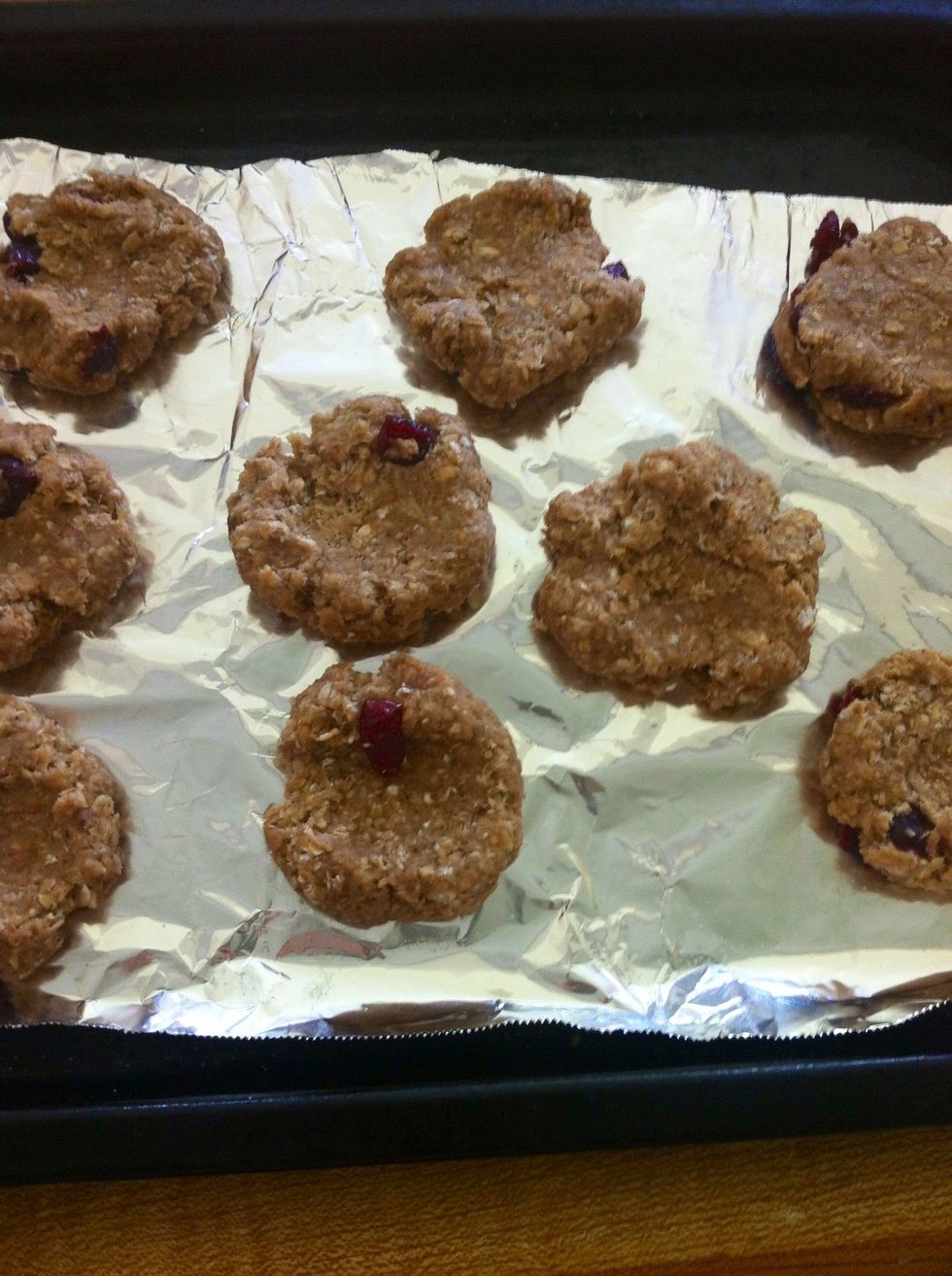 Roll the dough into little balls and then flatten them out each with a spoon!