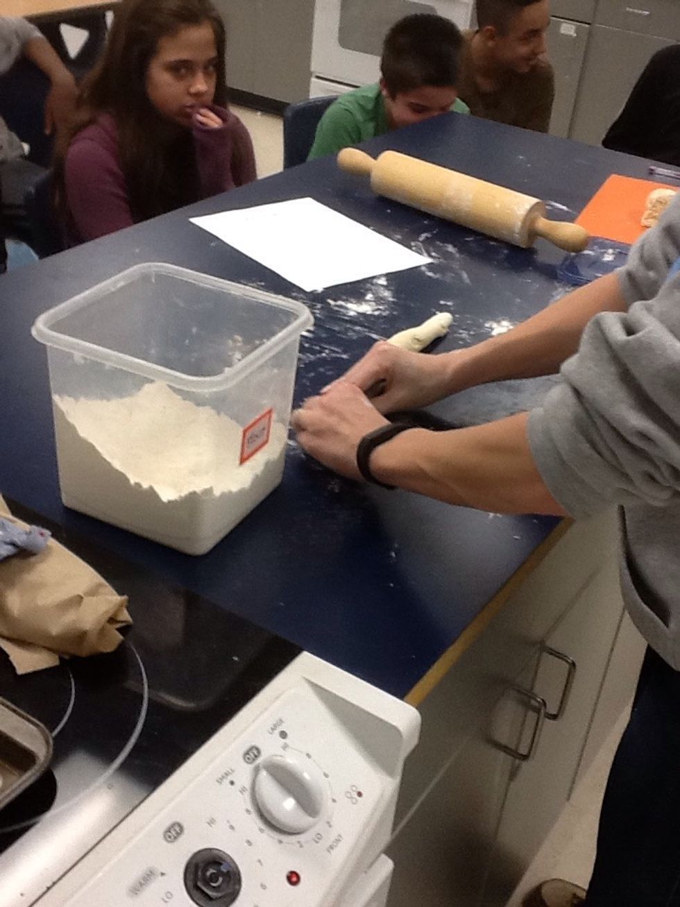 Roll the dough into on long roll