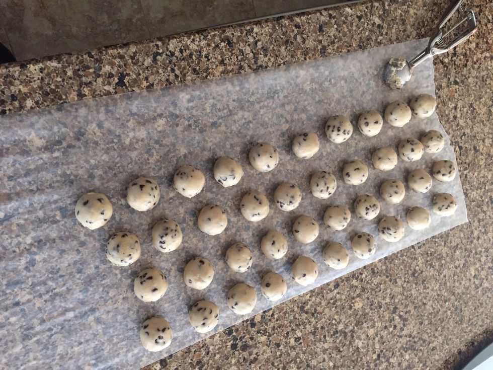 Roll the dough into small balls. Place on a wax paper cookie sheet. Then take all of them back into the refrigerator until you are ready to dip them in chocolate.
