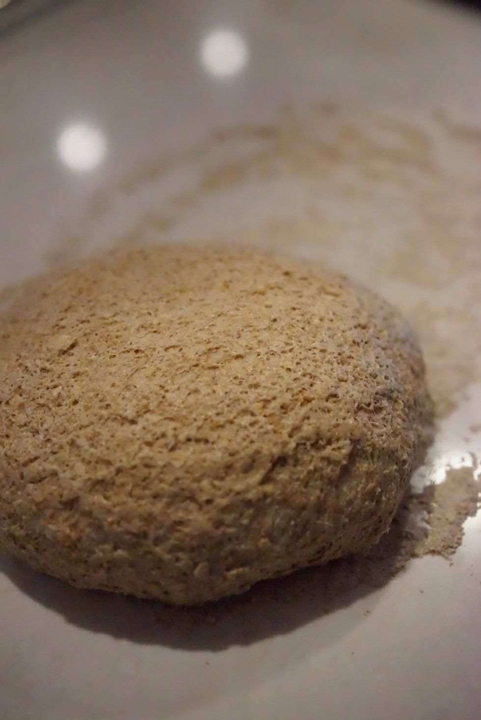 Roll the dough over the lightly floured work surface. Cut the dough in to two halves.