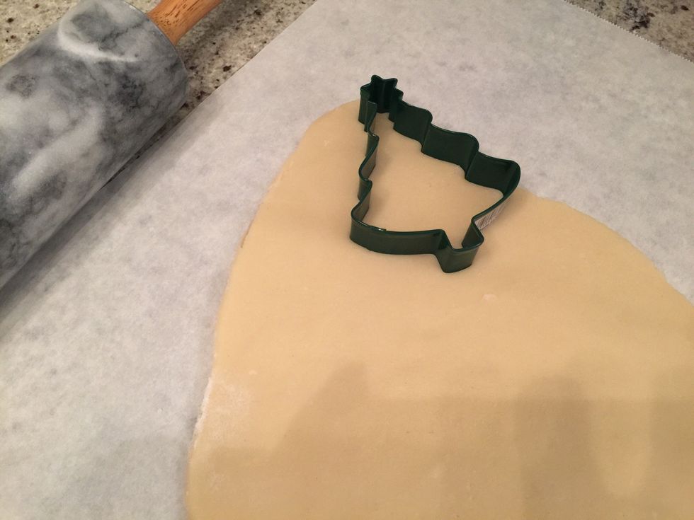 Roll the dough until it is 1/4 inch thick. Place the cookie cutter and press.\n\nIf the dough sticks to roller, wipe the roller with flour.