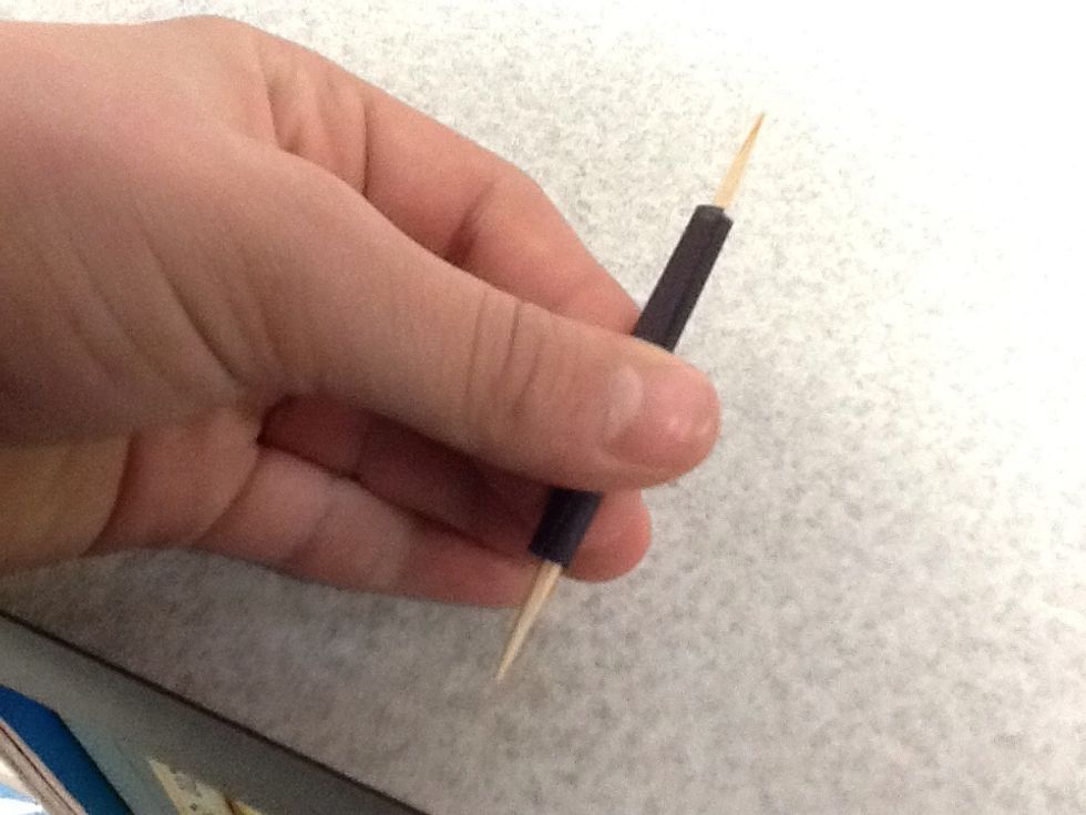 Roll the eye piece on the toothpick, then secure it with tape