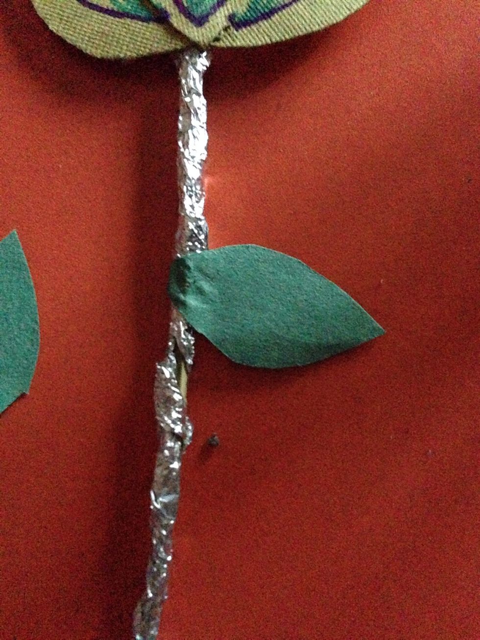 Roll the glued side on the stick as shown. Do the same for others but pls see the next step