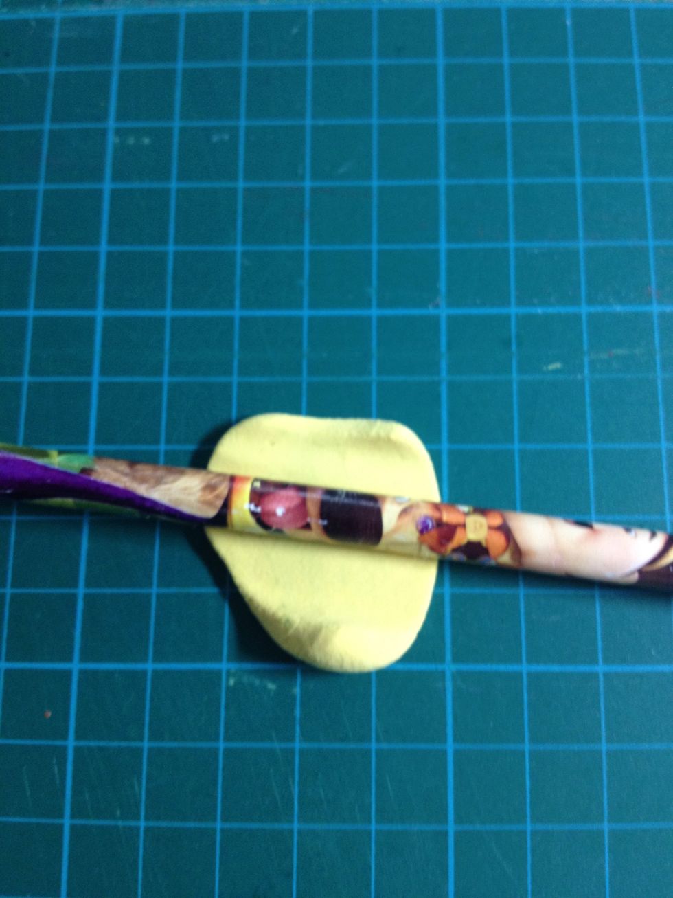 - Roll the light yellow clay to flat for making the cheese.