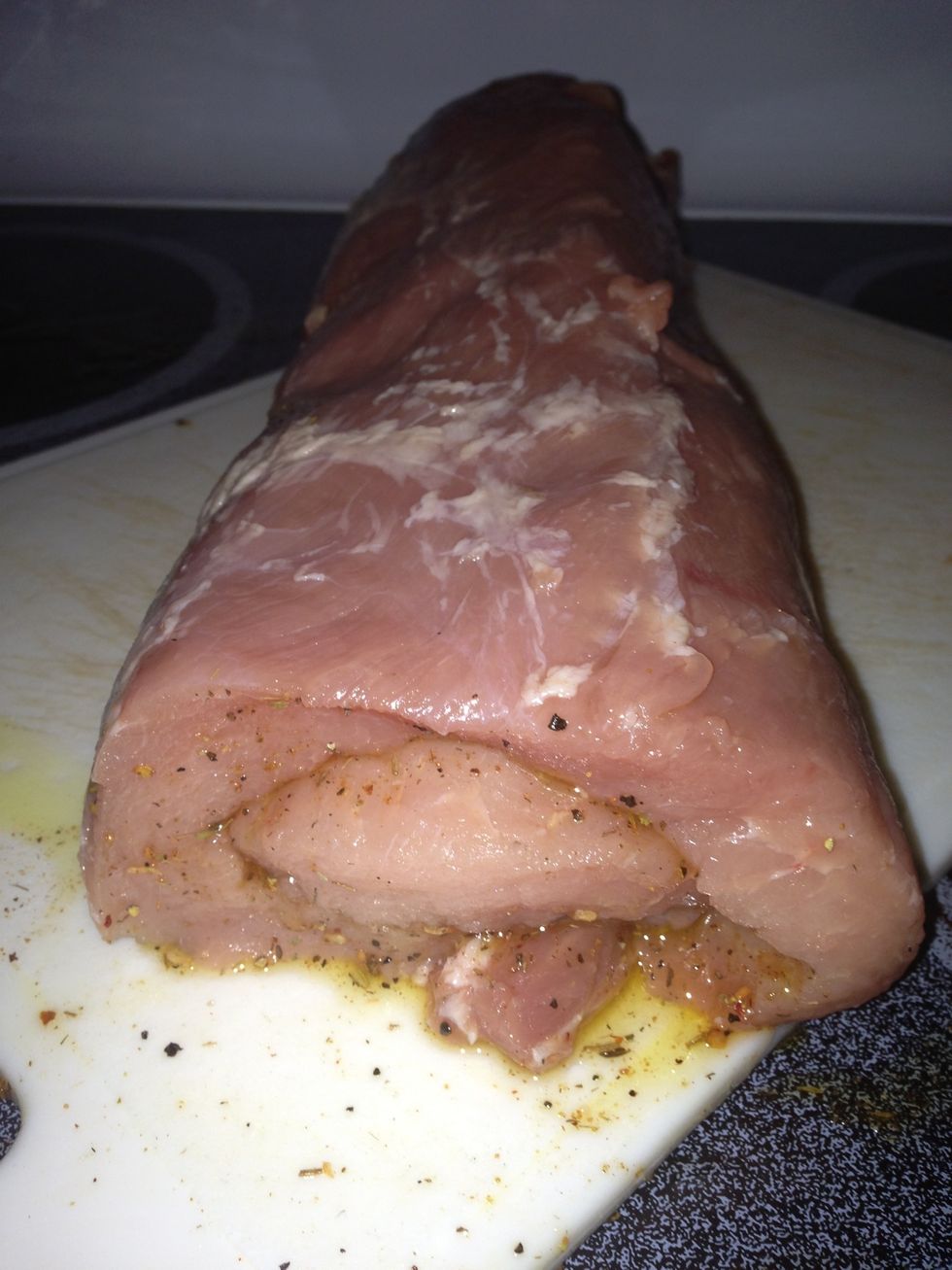 Roll the loin back up. You can add more oil and seasonings to the outside as well, if you wish.