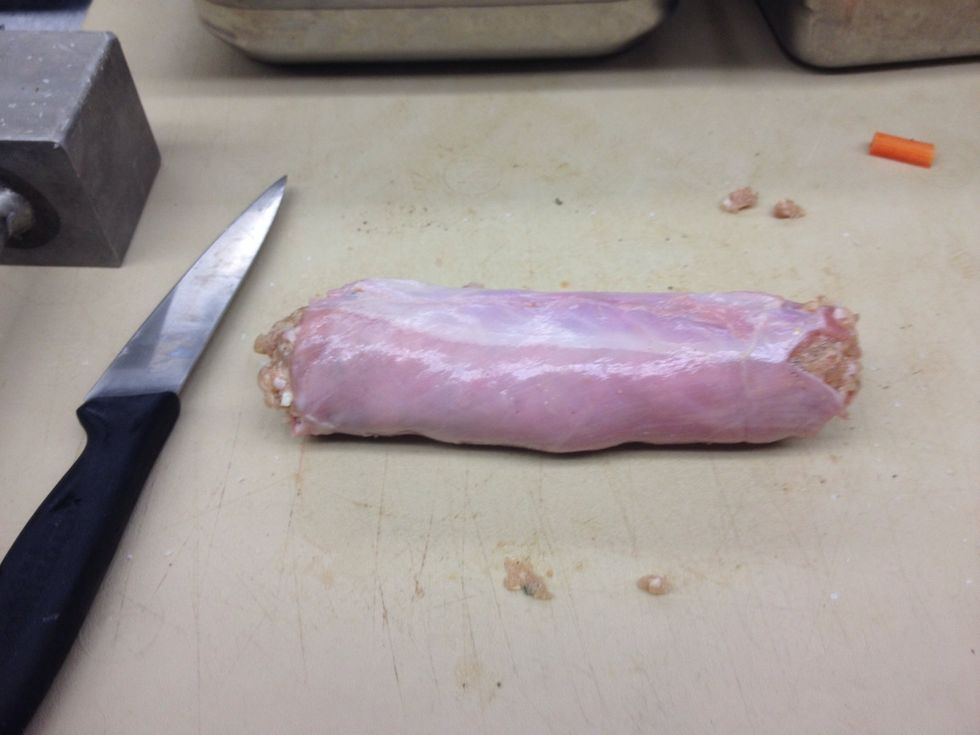 Roll the loin over the belly and forcemeat forming a log.