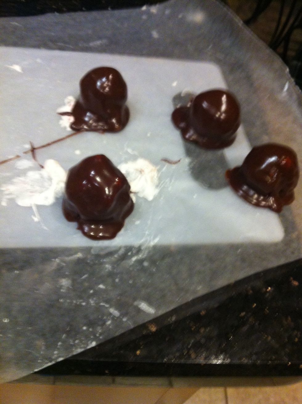 Roll the marshmallow caramel balls in the choco