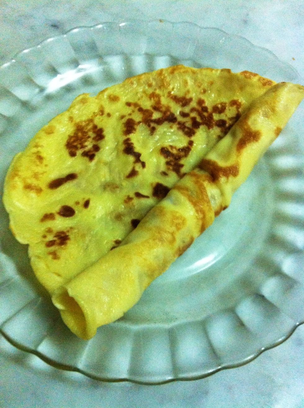 Roll the pan cake. Be careful not to burn your fingers, wait few seconds then start rolling.