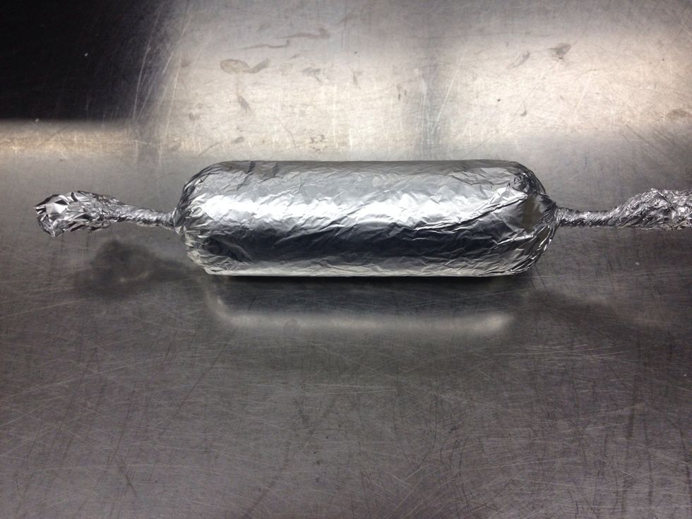 Roll the porchetta up in the tin foil, twisting the ends to create a tight log. Chill for 30 min. Sear the foil wrapped log in hot saut\u00e9 pan, about 2 min per side.