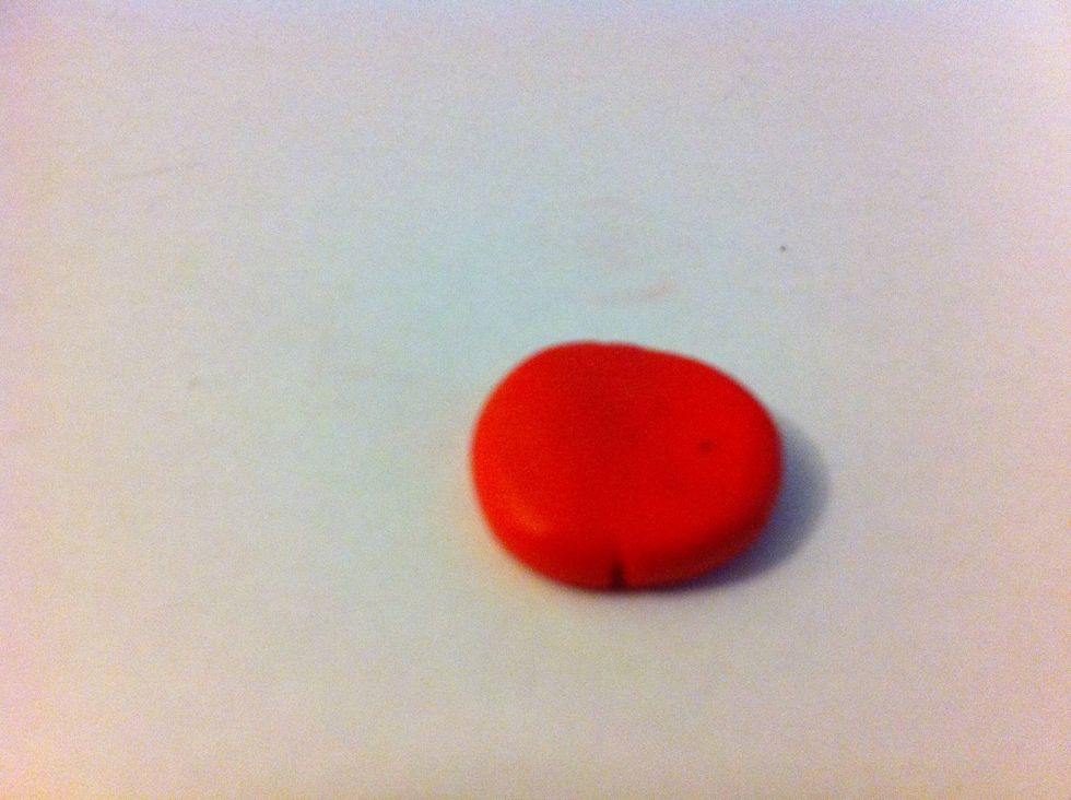 Roll the red color into circle and press center.