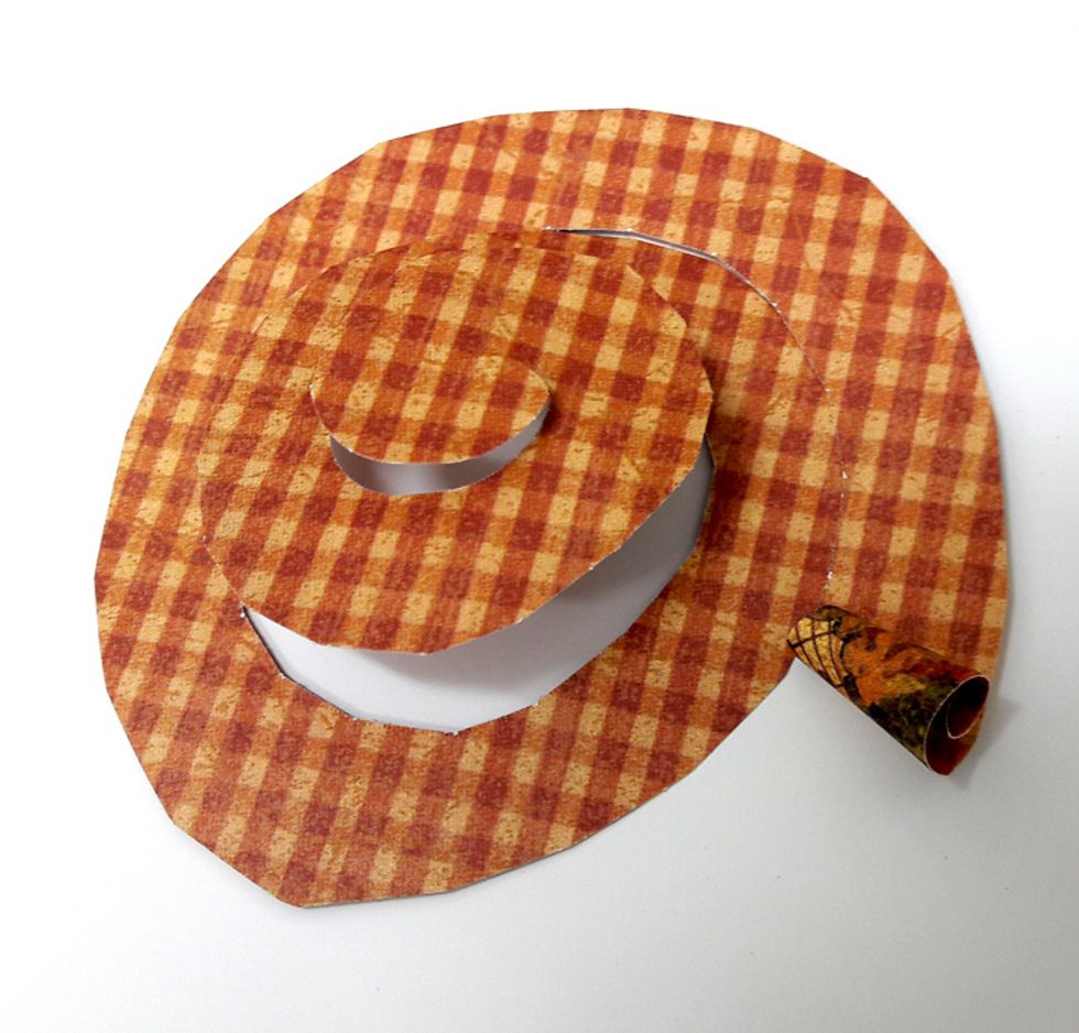 Roll the spiral all the way to the center.