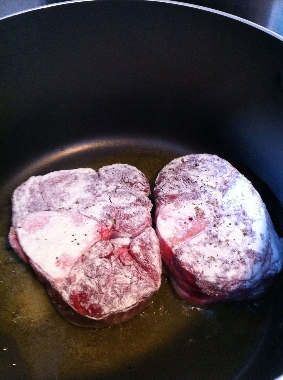 Roll the veal in flour salt and pepper and brown in olive oil for about 5 mins on each side