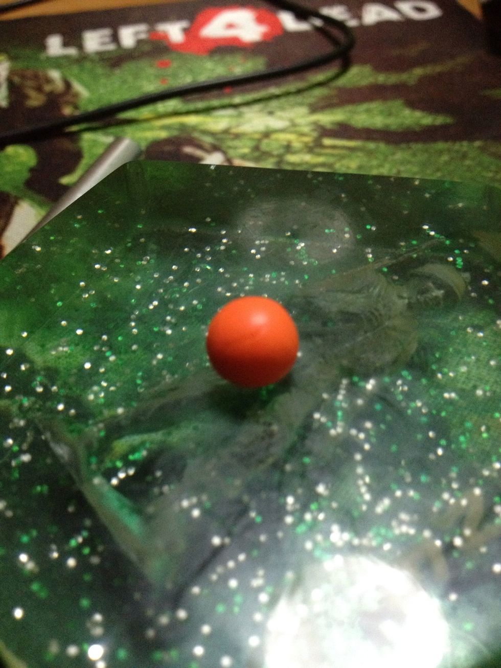 Roll the wrapped chocolate candy into a ball.