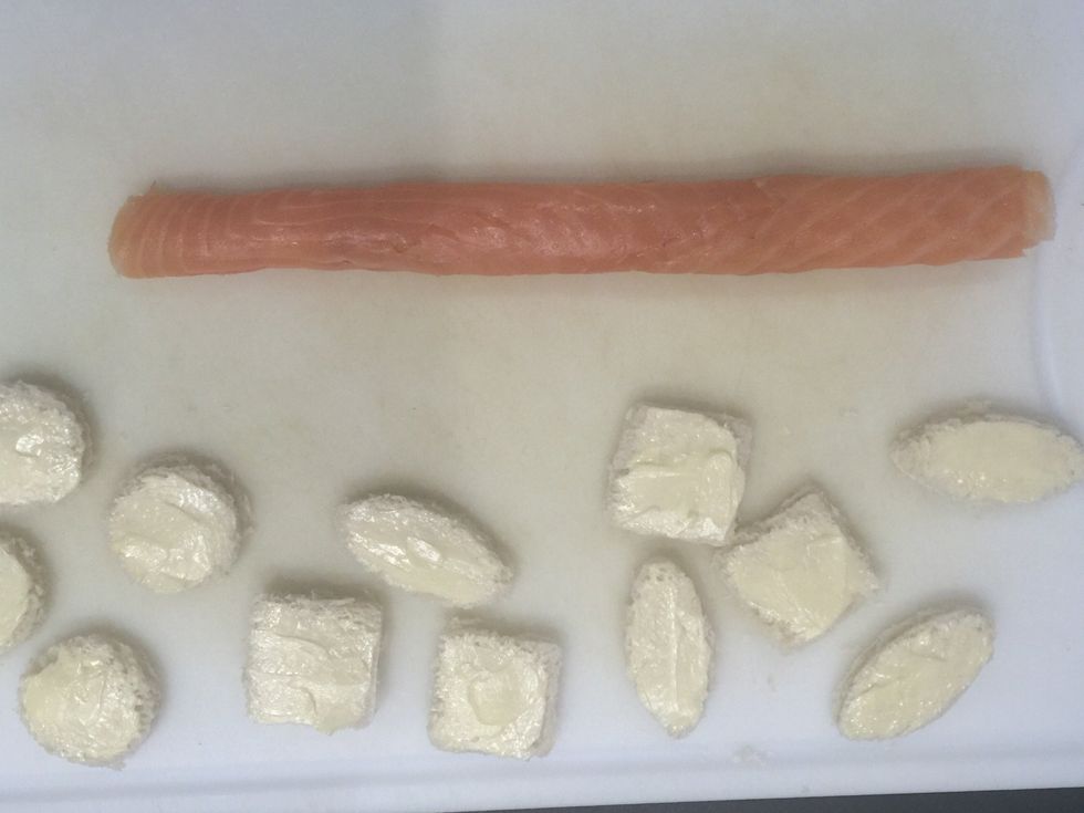 Roll tight the salmon rectangle. You can use kitchen plastic film