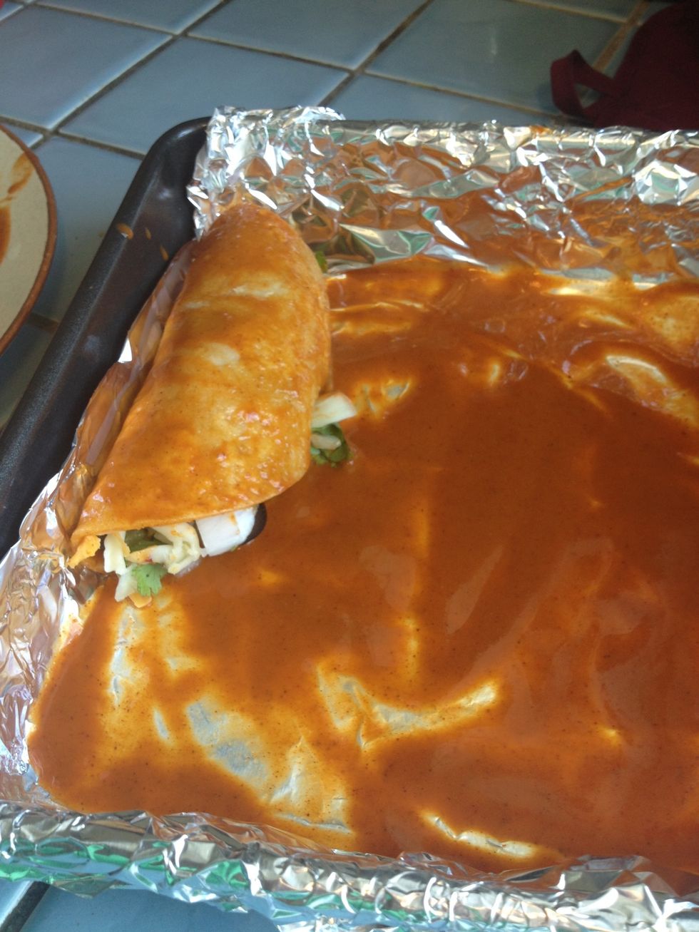 Roll up and put in the baking pan. Repeat this step with each of your corn tortillas.