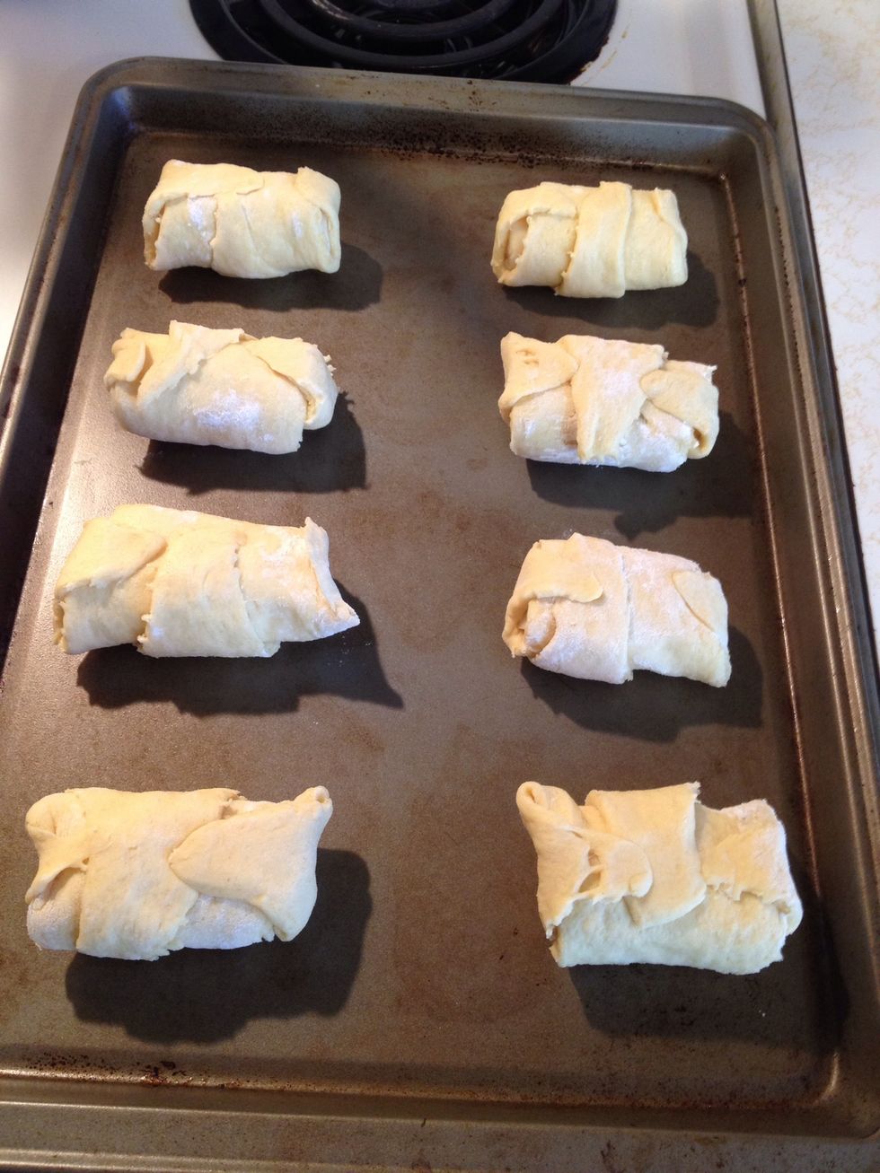 Roll up the cheese and pepperoni in the crescent roll and make sure to fold up the corners so the cheese doesn't come out. Bake in the oven at 350 for 10 minutes or until golden brown.
