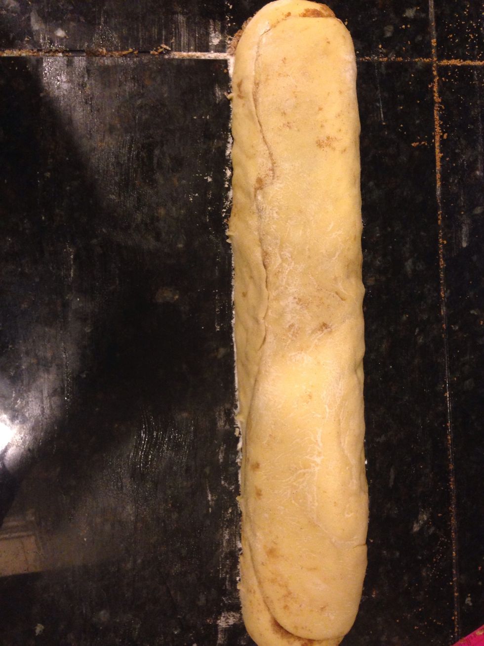 Roll up the dough into a log and seal the seam.