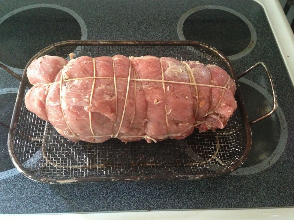 Roll your loin tightly starting at the bottom. Try to keep everything inside. Wrap the loin together with butcher's (kitchen) twine. Yes, I know this is a bad looking wrap job, but it will work!