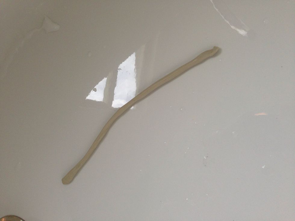 Roll your putty into a piece about 5"-7" long and about as thick as a pencil.