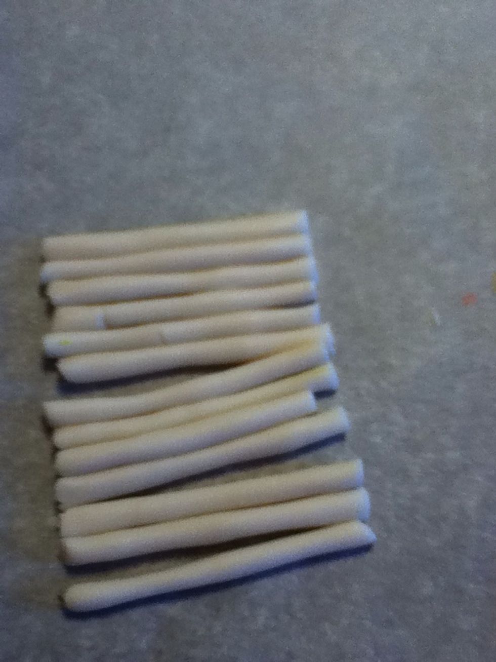 Roll your transparent clay into a long cylinder and cut into even lengths.