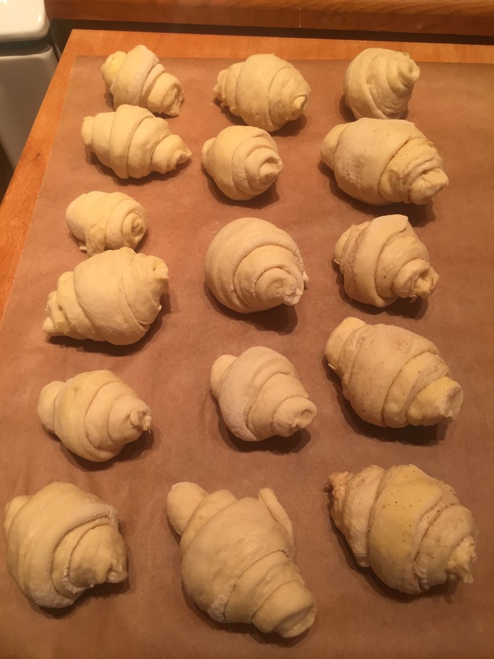 Rolled and ready for the yeast to rise. Stretch dough while rolling to get them tight. Look more like Italian cornettos than French croissants the way I roll them.