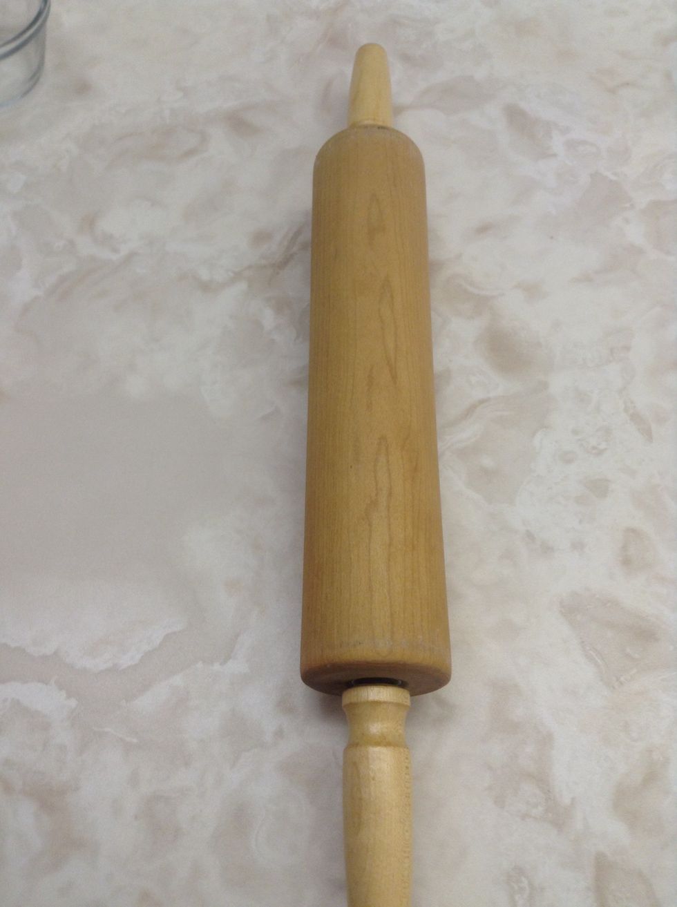 Rolling pin. Used to roll out dough. I can use a rolling pin to flatten dough for a pizza.