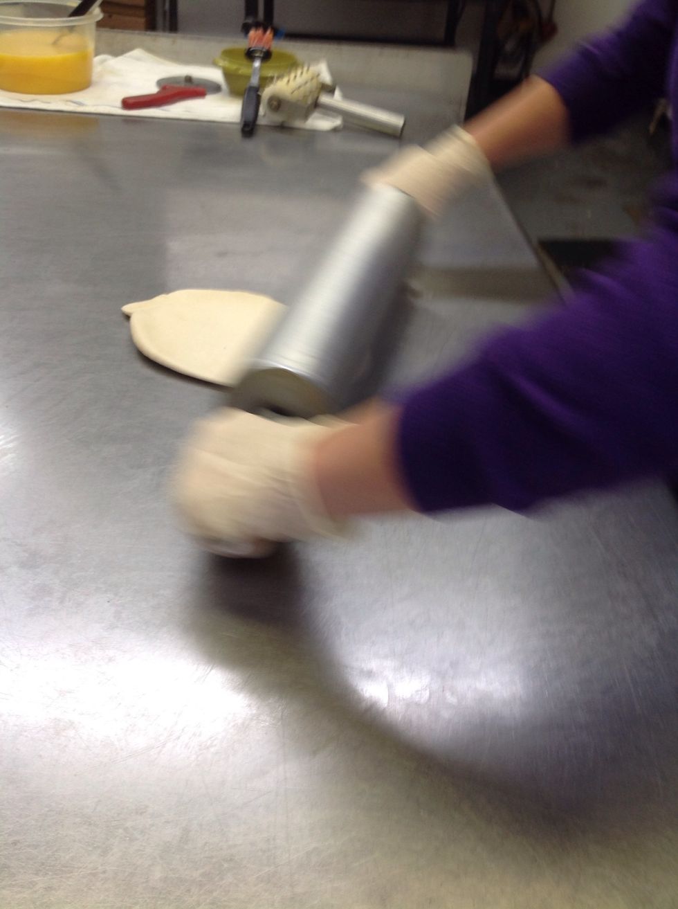 Rolling the dough out in a circle