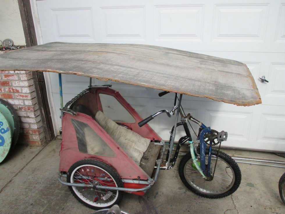 Roof/table high enough to sit down and drive / pedal out and about.