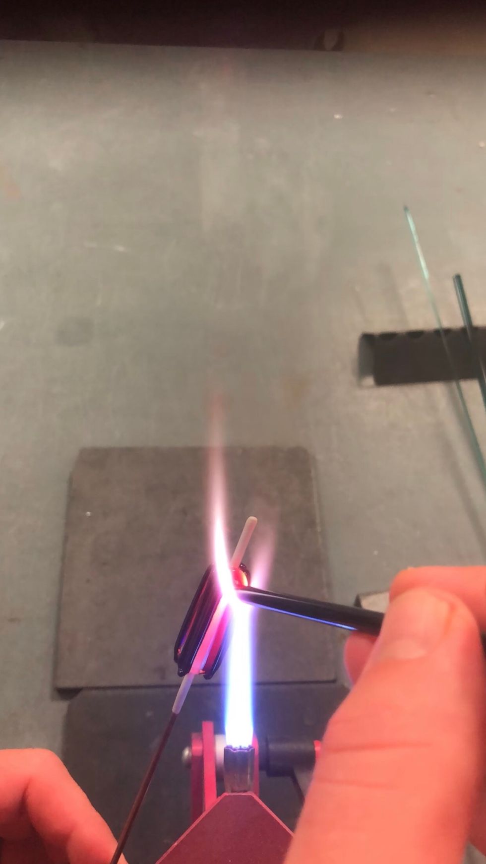 Rotate the bead 90 degrees and apply a third stripe between the first two.