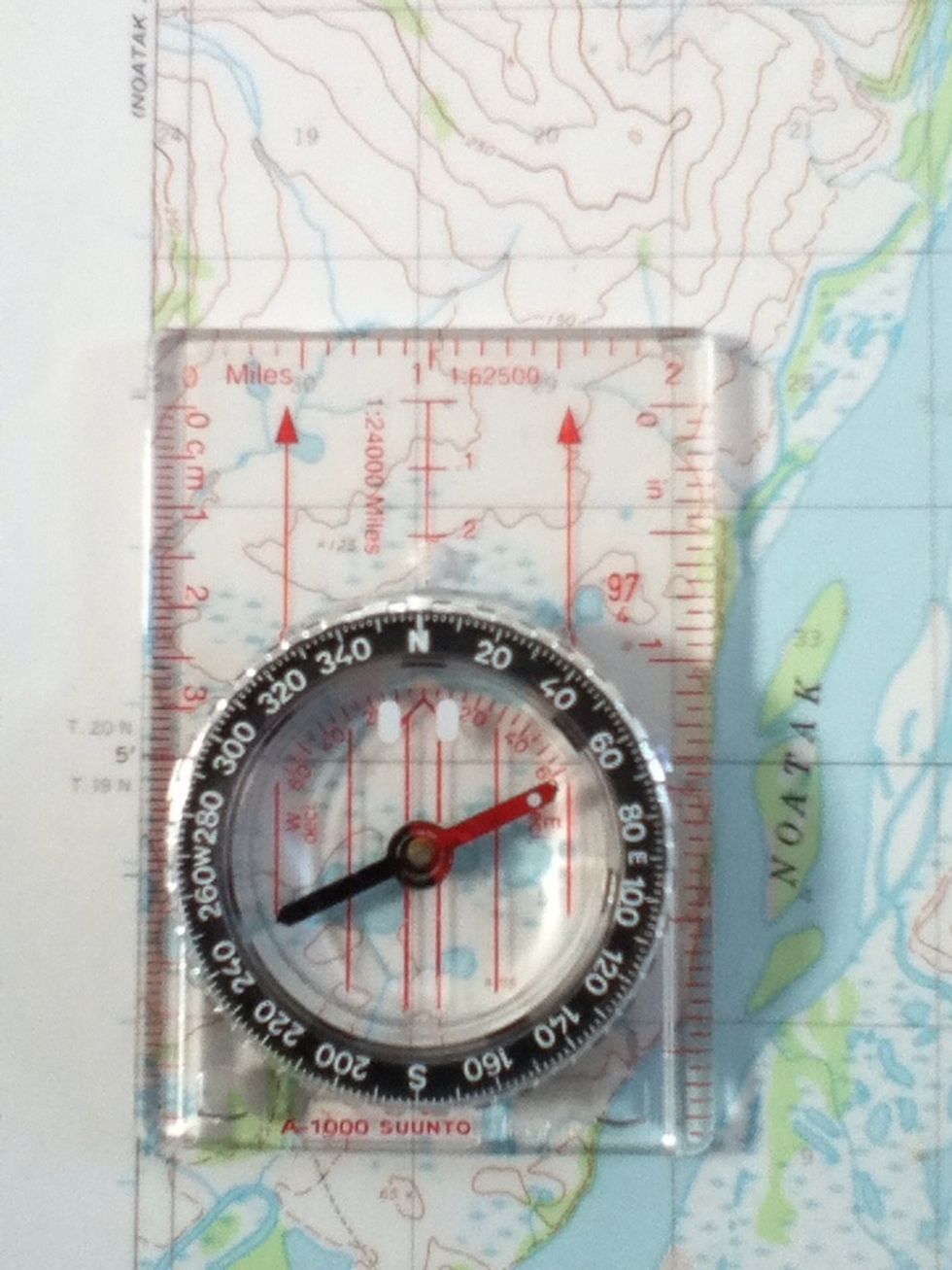Rotate the dial until 0 degrees or North is at the front of the compass. There should be an arrow or tic mark to line the dial up with.