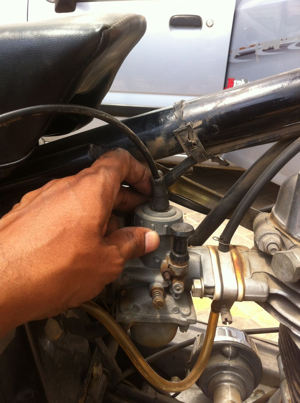 Rotate the lid anti clockwise and remove it.