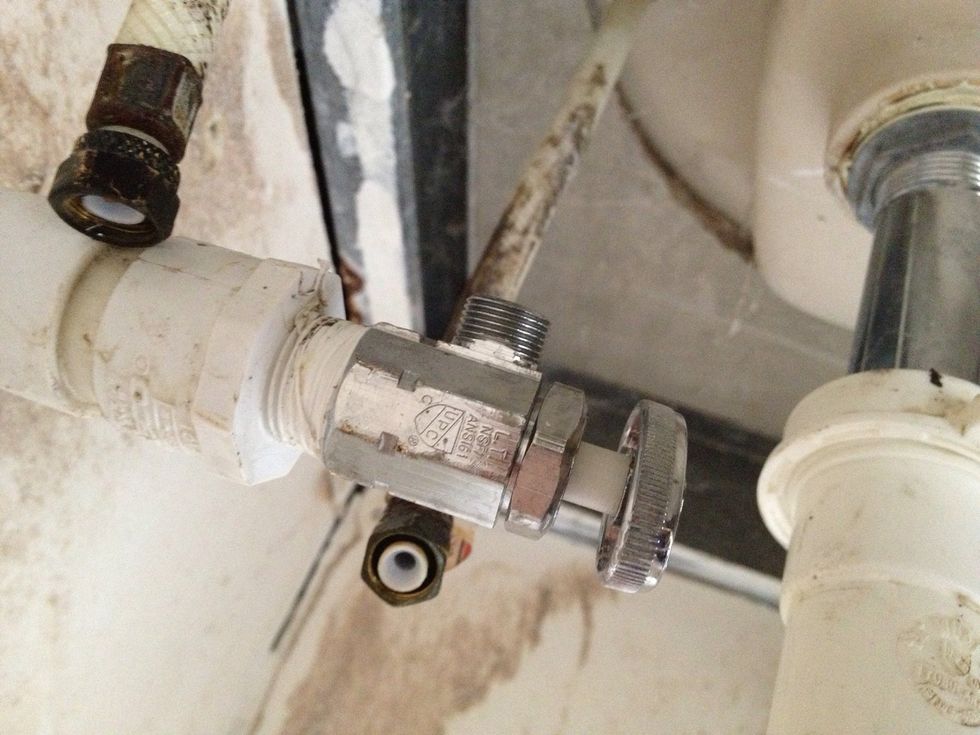 Rotate the valve around to face the necessary position and connect to the hose. Again, this will obviously loosen the valve and may cause it to leak. You can also just buy a longer hose so it reaches.