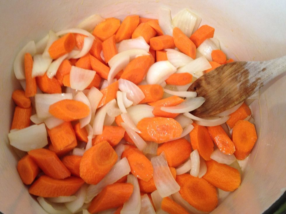 Rough chop the onion and carrots. Saut\u00e9 them in 2 Tblsp of the olive oil. Drain the tofu and cut into bite size cubes, while the vegetables soften.