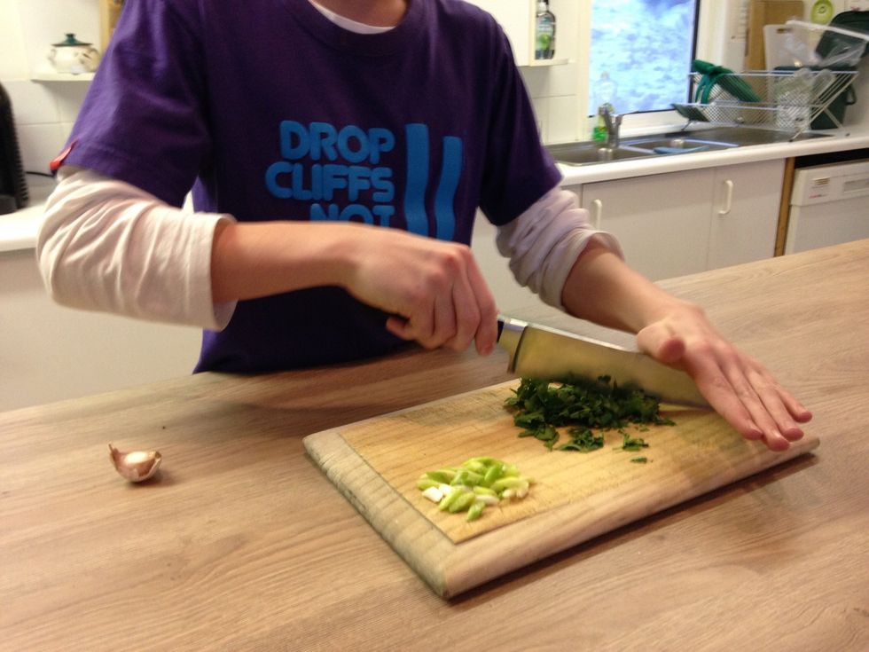 Roughly Chop parsley and chop spring onion on angle an about .5cm apart and finely chop garlic