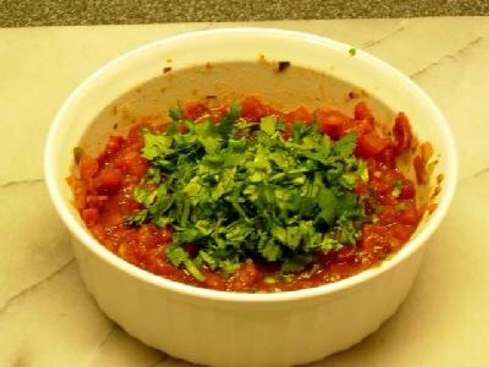 Roughly chop the cilantro and add it to the salsa.