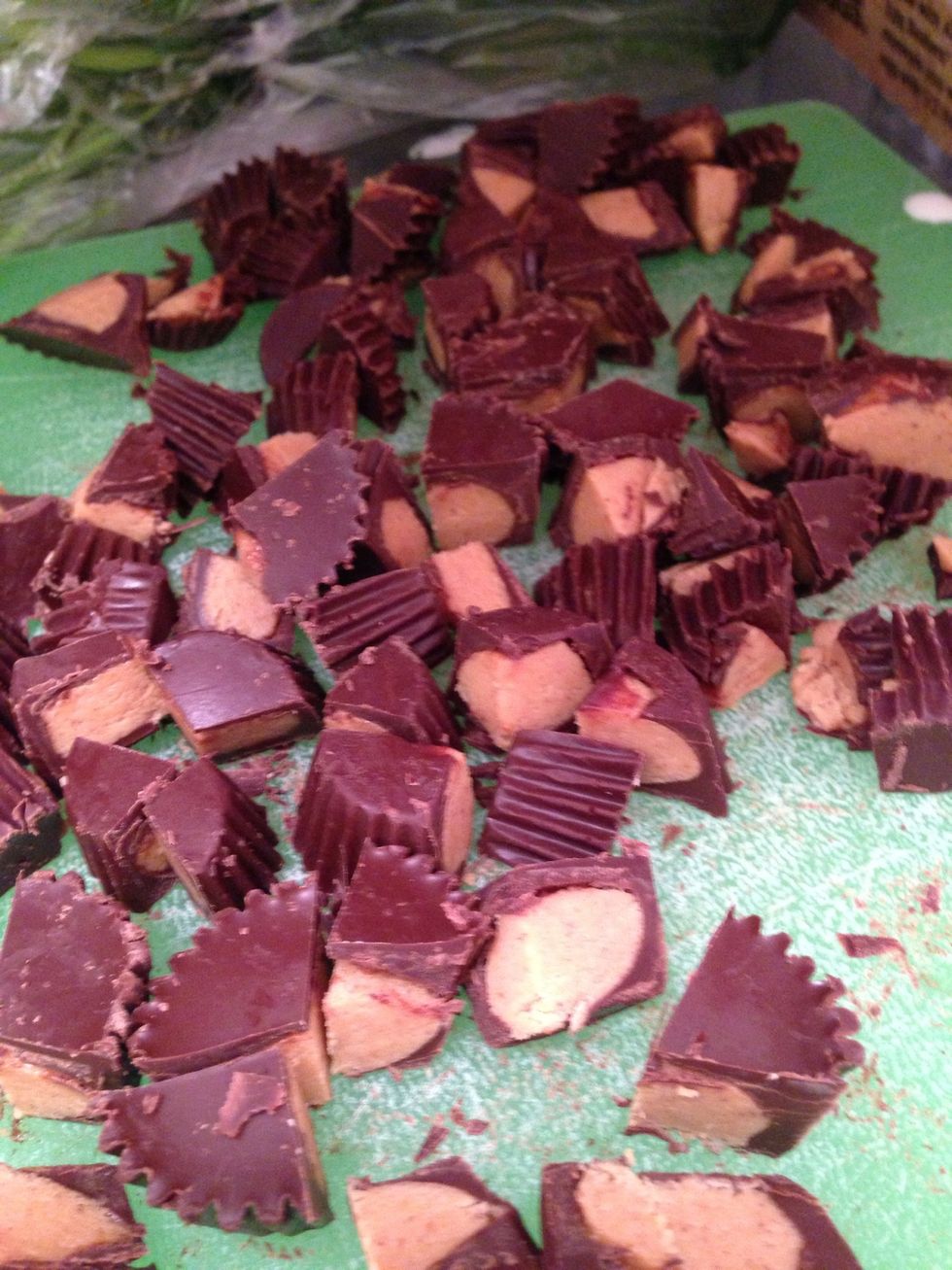 Roughly chop up 20 miniature Reese's peanut butter cups.