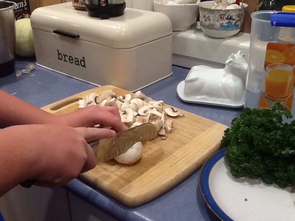 Roughly chop washed mushrooms and add to saut\u00e9 pan, stir to combine mixture.