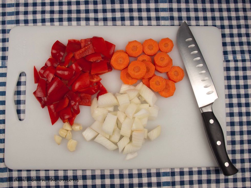 Roughly chop your onion, pepper, carrot and garlic.