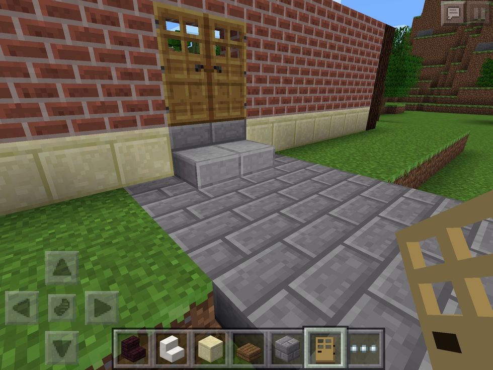 Roughly in the middle, make a room for a double door. I've made a lovely path up to the entranceway! We will create the garden in a later guide, so don't worry about that yet!