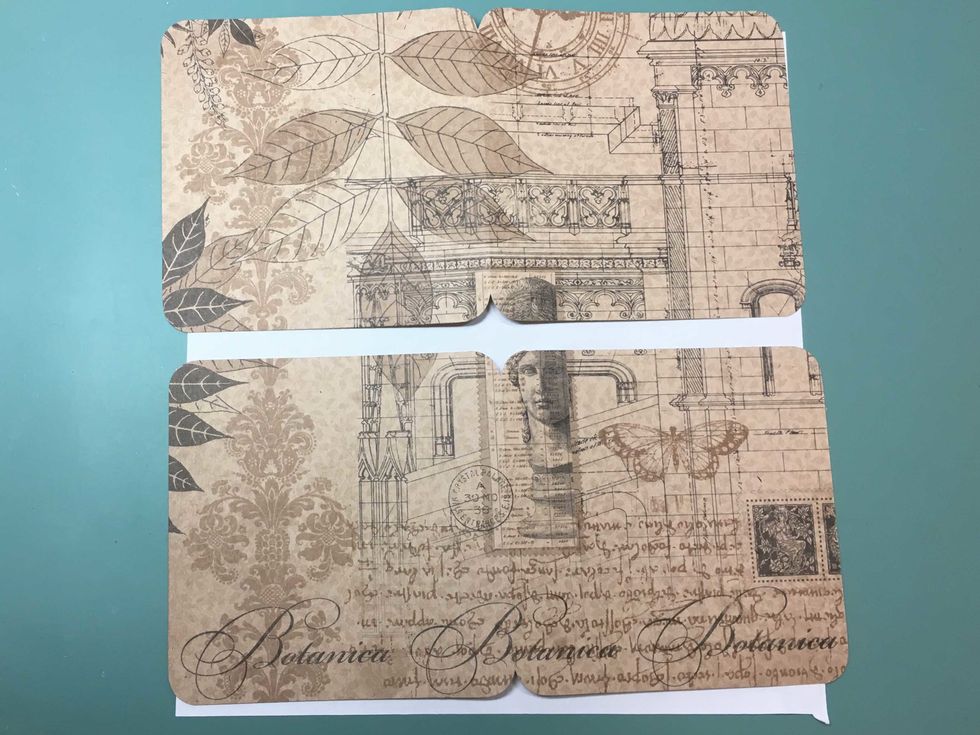 Round the corners. Fold the paper along the score line and round the inner corners also.