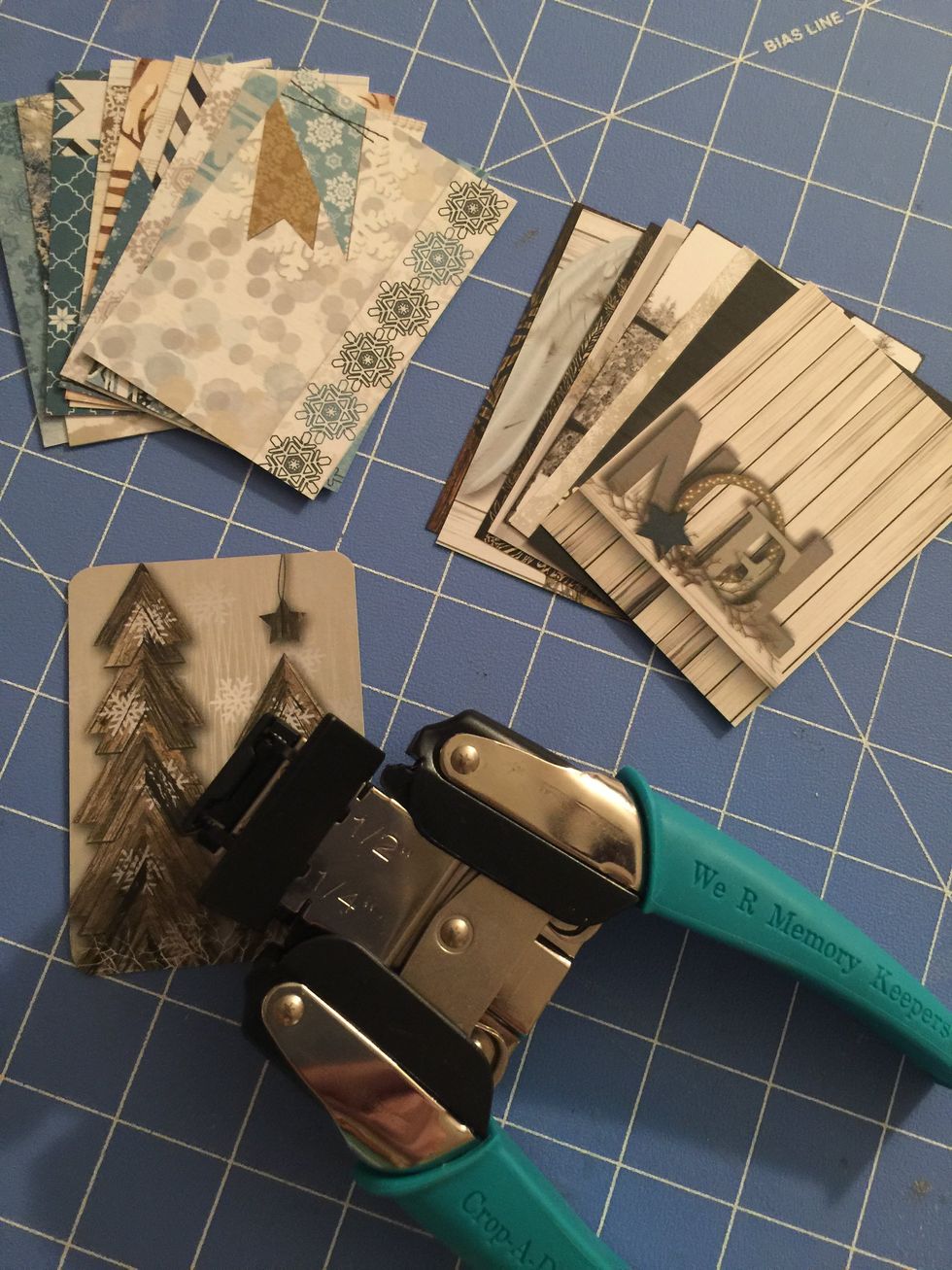 Round the corners of the cards using a corner chomper