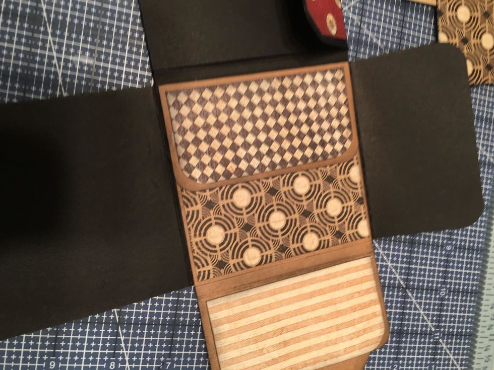 Round the corners of the patterned paper and attach to the pocket section as shown above.