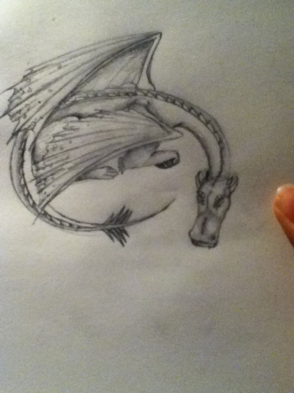 Round the head and tail. And your done! Colour it with pencils for best effect. Keep looking for a flying dragon or stop here. Thanks for looking, like and comment!