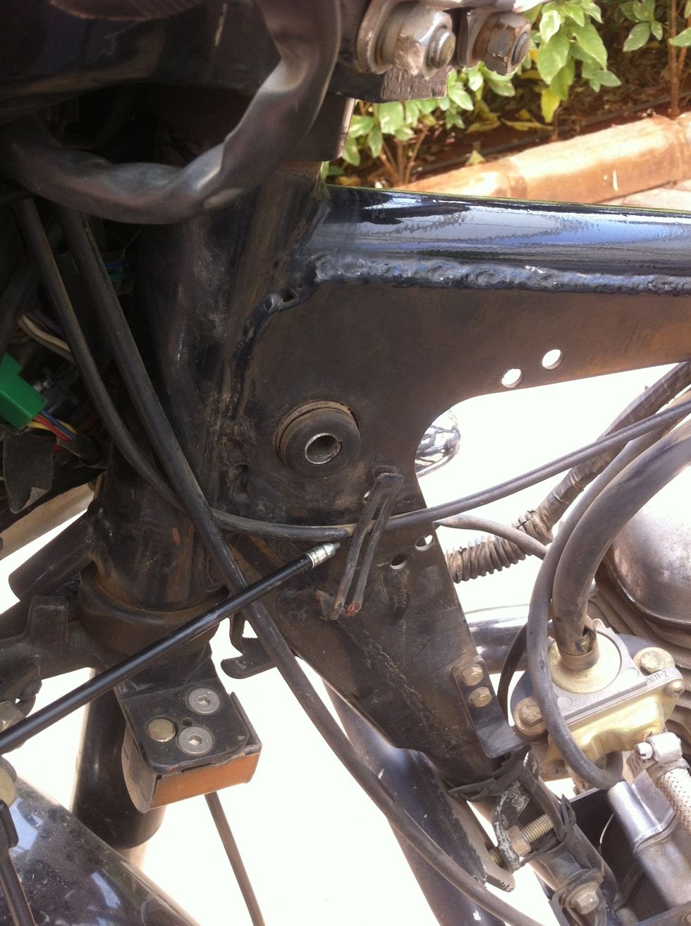 Route the cable through the frame hook.