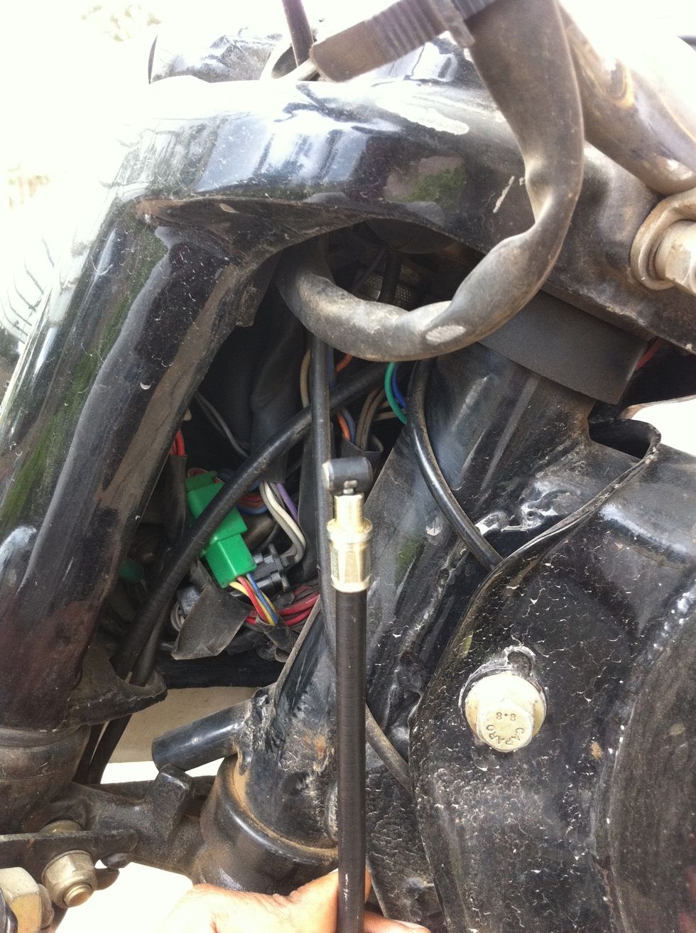 Route the cable through the headlamp casing