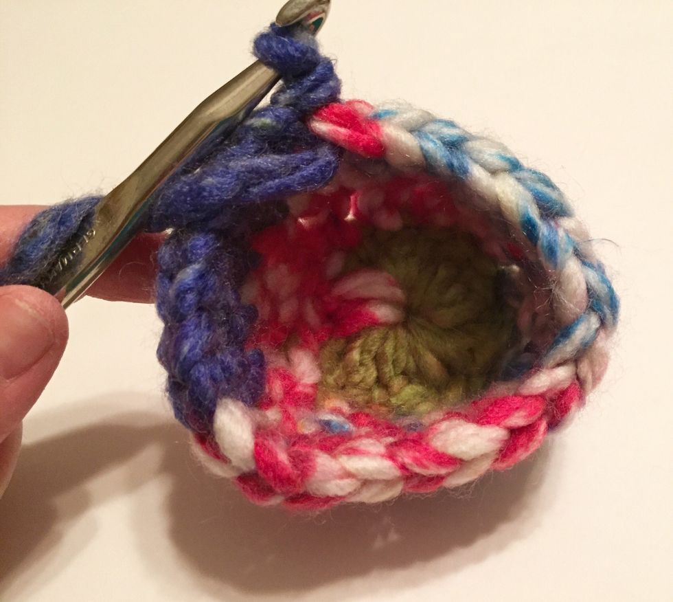 row 3: chain 3 and double in top of next double, chain 1. skip chain 1 in previous row and double in top of next 2 doubles. continue around and slip stitch to connect.