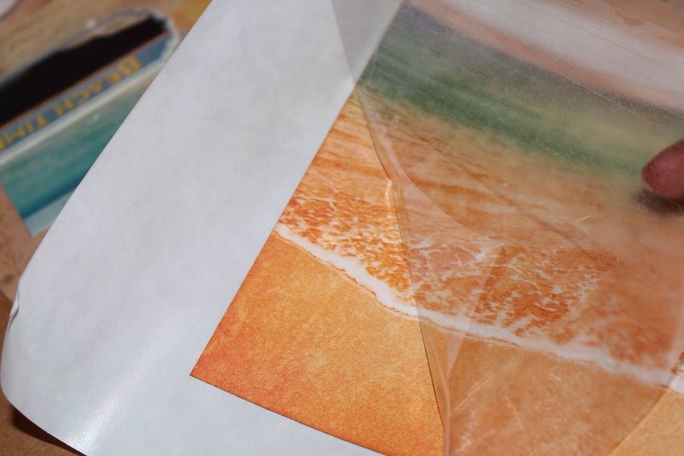 Rub edges and then remove film.